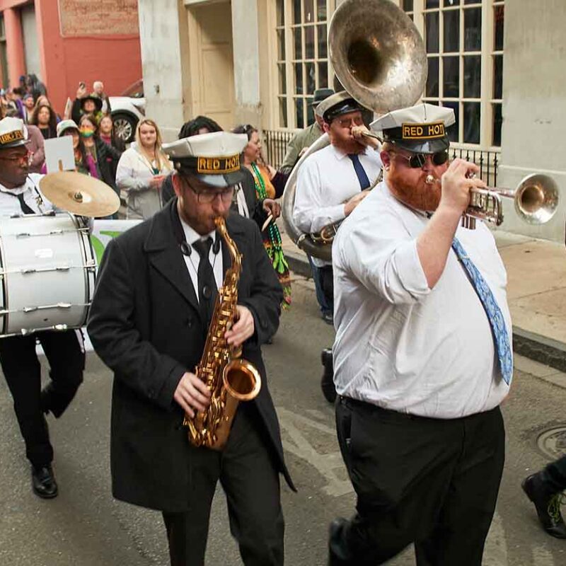 Band marching down street playing at ACA event in New Orleans